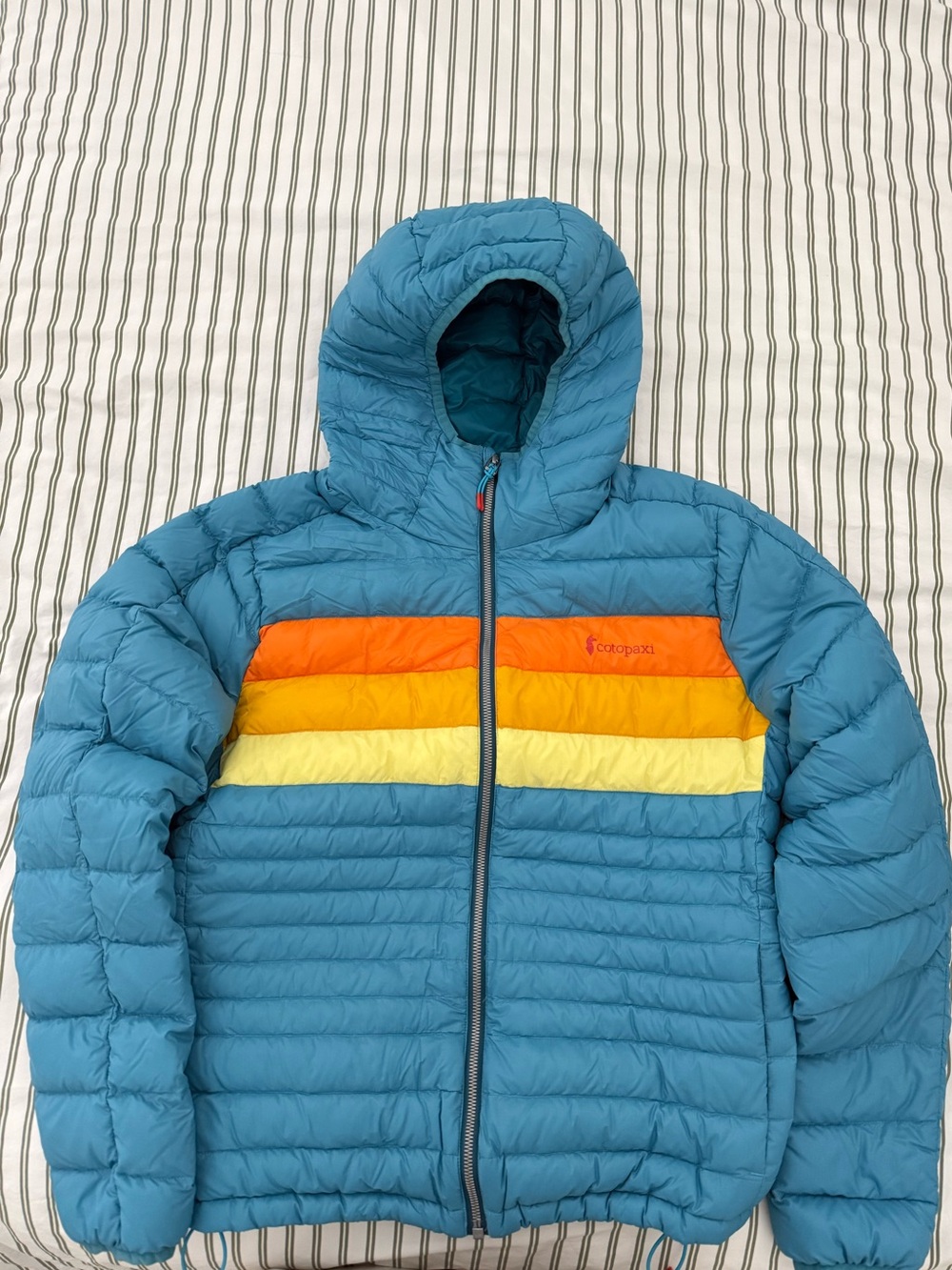 cotopaxi Teal Hooded Puffer Jacket with Orange, Yellow and Cream Stripes